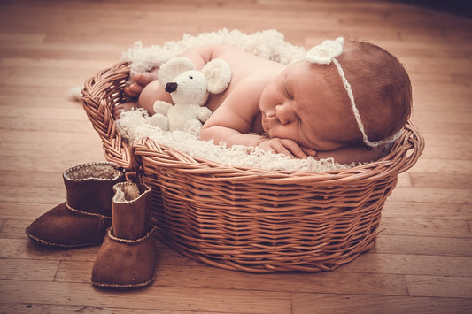 Photo of baby sleeping in a basket