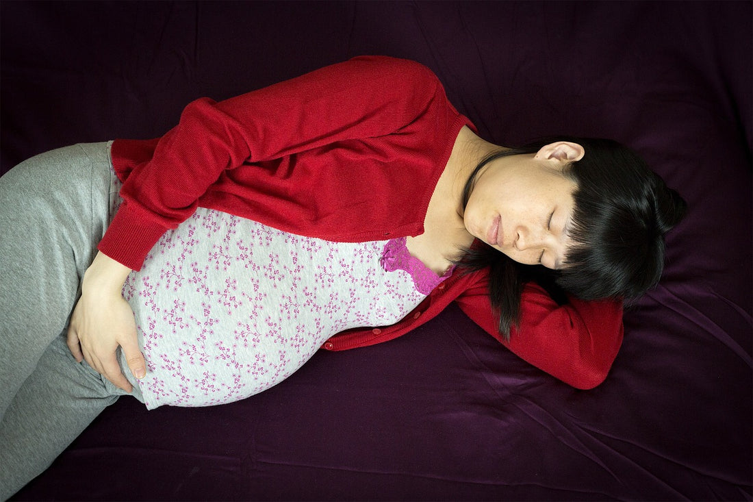 Photo of Pregnant sleeping woman